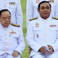 Thai Prime Minister Prayut Chan-ocha (right) poses alongside Deputy Prime Minister Prawit Wongsuwan at Government House in Bangkok in 2019. | AFP-JIJI