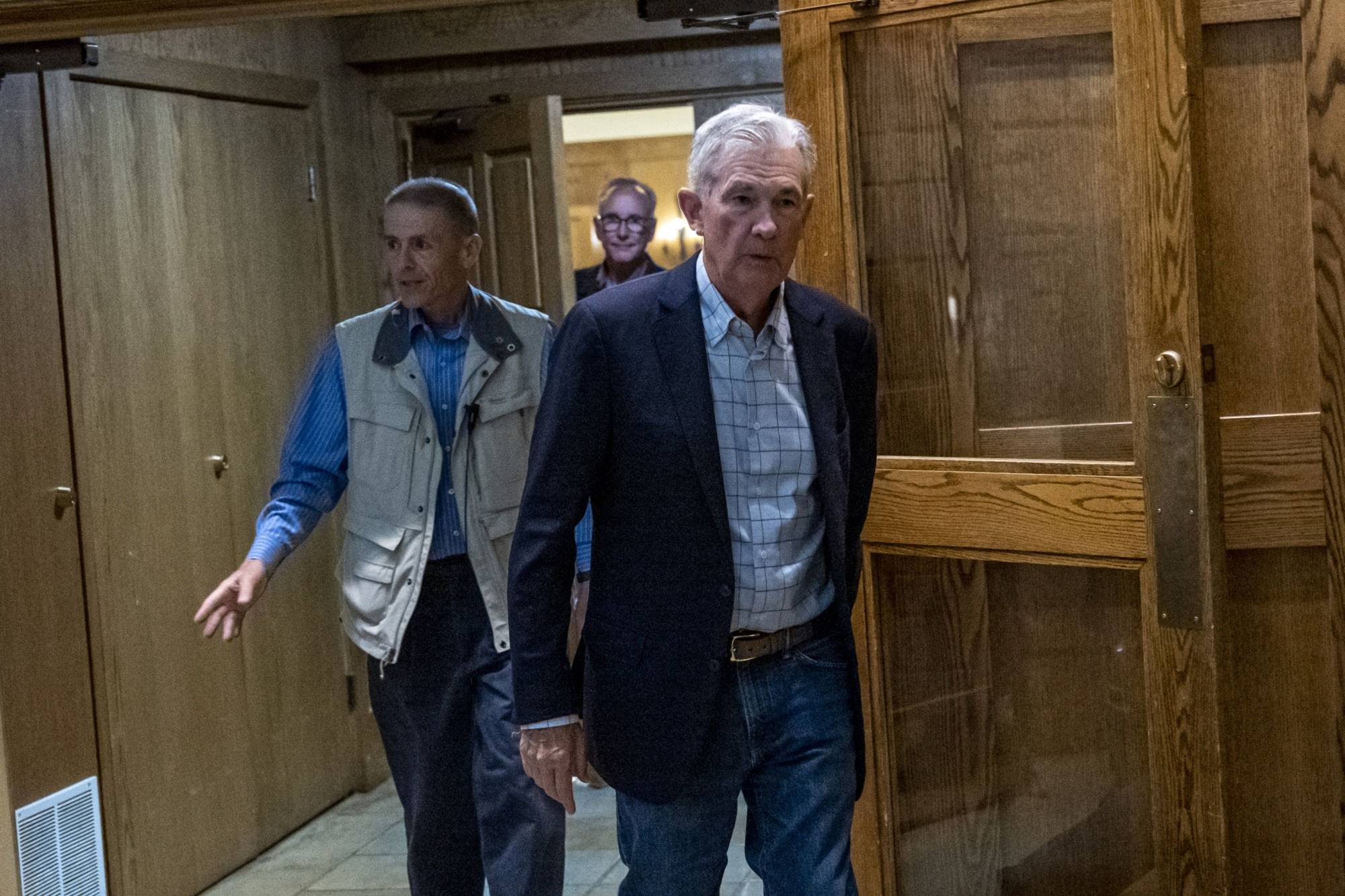 U.S. Federal Reserve Chair Jerome Powell leaves the reception dinner at the Jackson Hole economic symposium in Wyoming on Aug. 25. | Bloomberg 