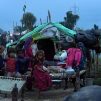 Flood-hit people take shelter at a makeshift camp after heavy monsoon rainfall in Sindh province, southern Pakistan, on Thursday. | AFP-JIJI