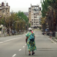 A ruined street in Mariupol, Ukraine, on Saturday. Thousands of people have been killed, millions displaced and cities blasted to ruins. The war has also threatened the global economy with an energy and food supply crisis. | AFP-JIJI