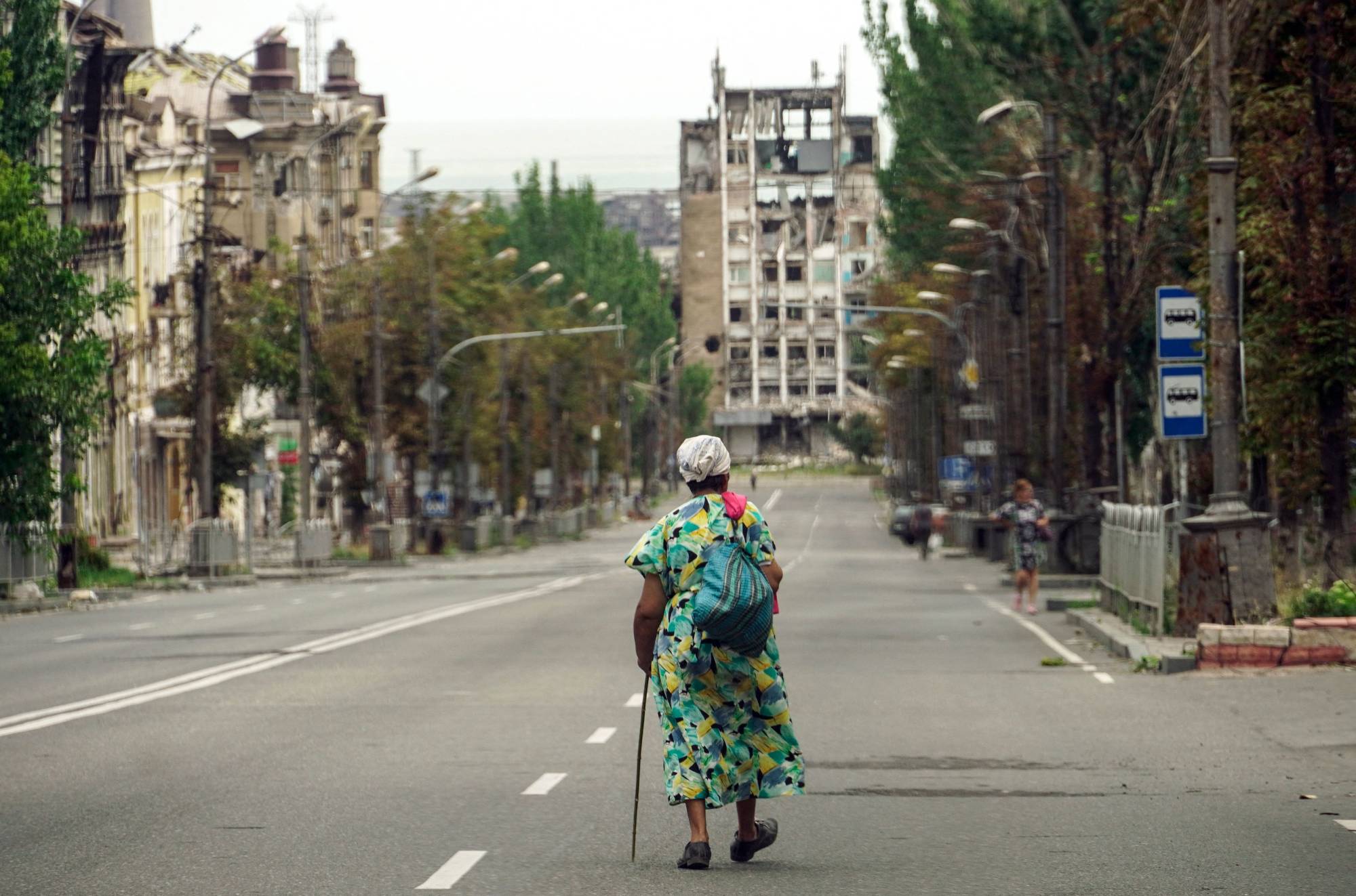 A ruined street in Mariupol, Ukraine, on Saturday. Thousands of people have been killed, millions displaced and cities blasted to ruins. The war has also threatened the global economy with an energy and food supply crisis. | AFP-Jiji