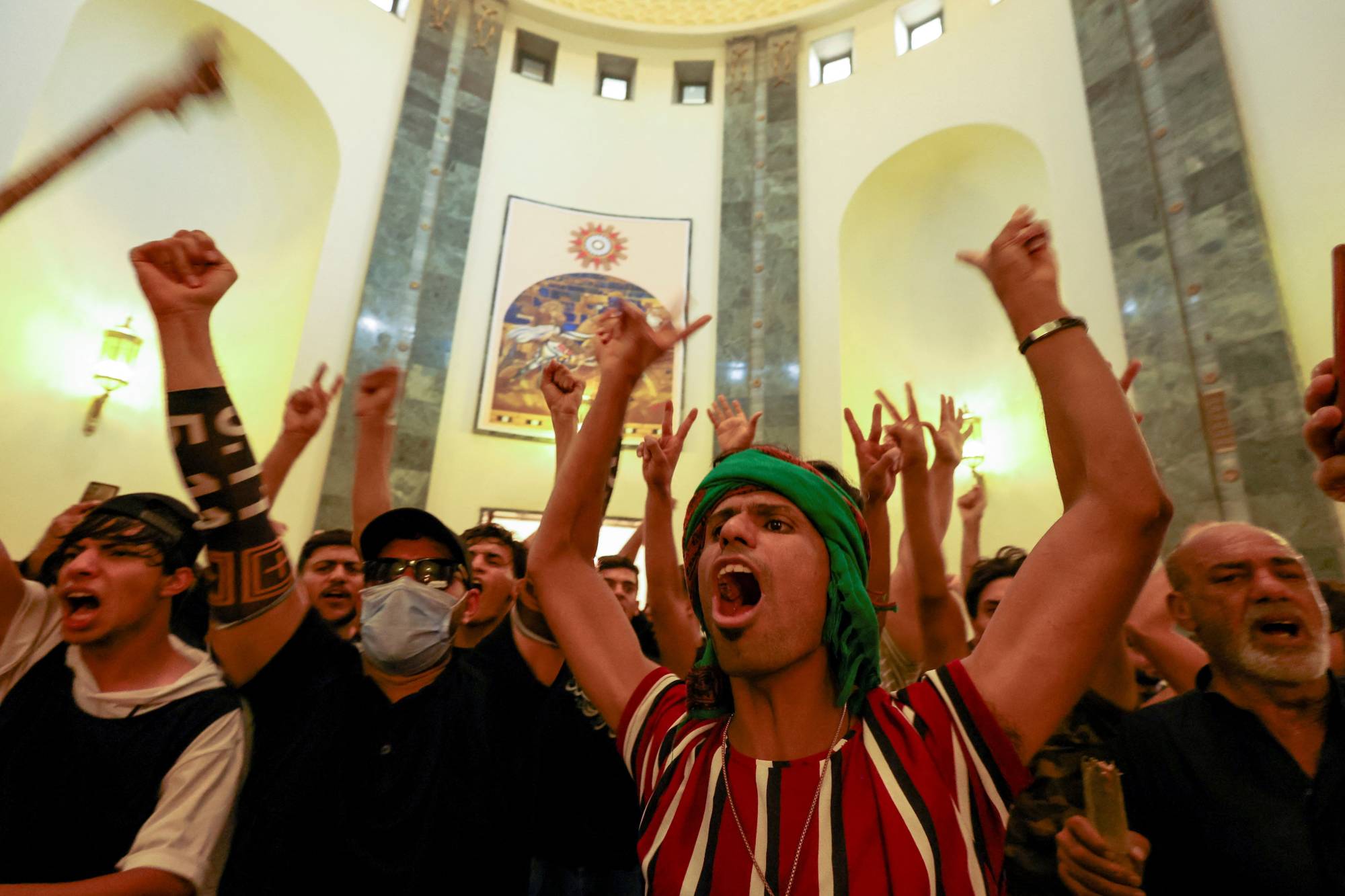 Supporters of Iraqi populist leader Moqtada al-Sadr protest at the Green Zone in Baghdad on Monday. | REUTERS