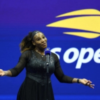 Serena Williams speaks to fans after her U.S. Open first-round win over Danka Kovinic in New York on Monday. | REUTERS