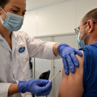 A nurse vaccinates a patient against monkeypox in Montpellier, southern France, on Aug. 23. | AFP-JIJI
