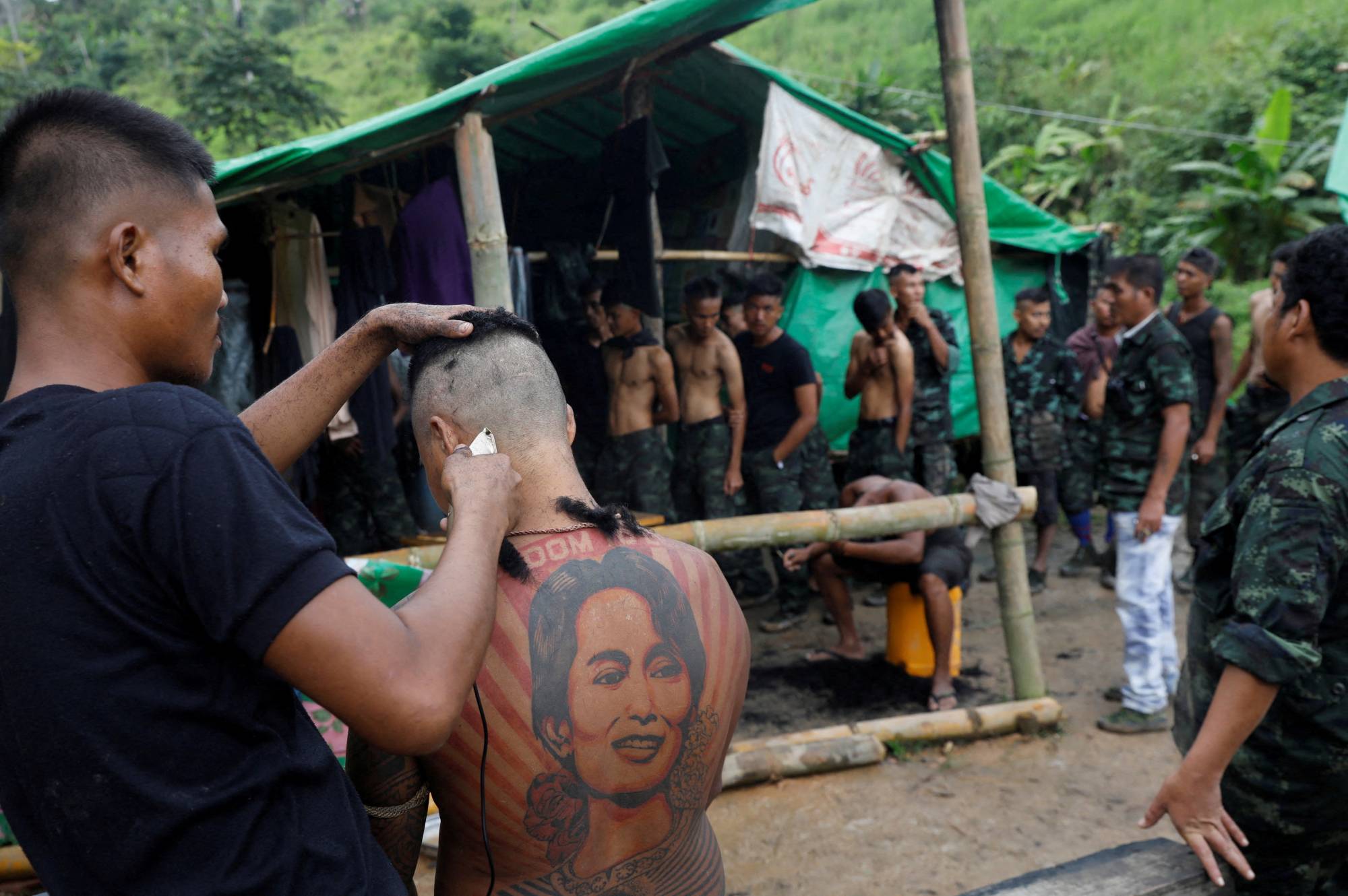 Civilian volunteers gather at a People's Defense Force training camp in an area controlled by ethnic Karen rebels in Myanmar's Karen State in September 2021.    | REUTERS