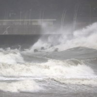 High waves off the coast of Miyazaki in Kyushu on Sunday. | KYODO