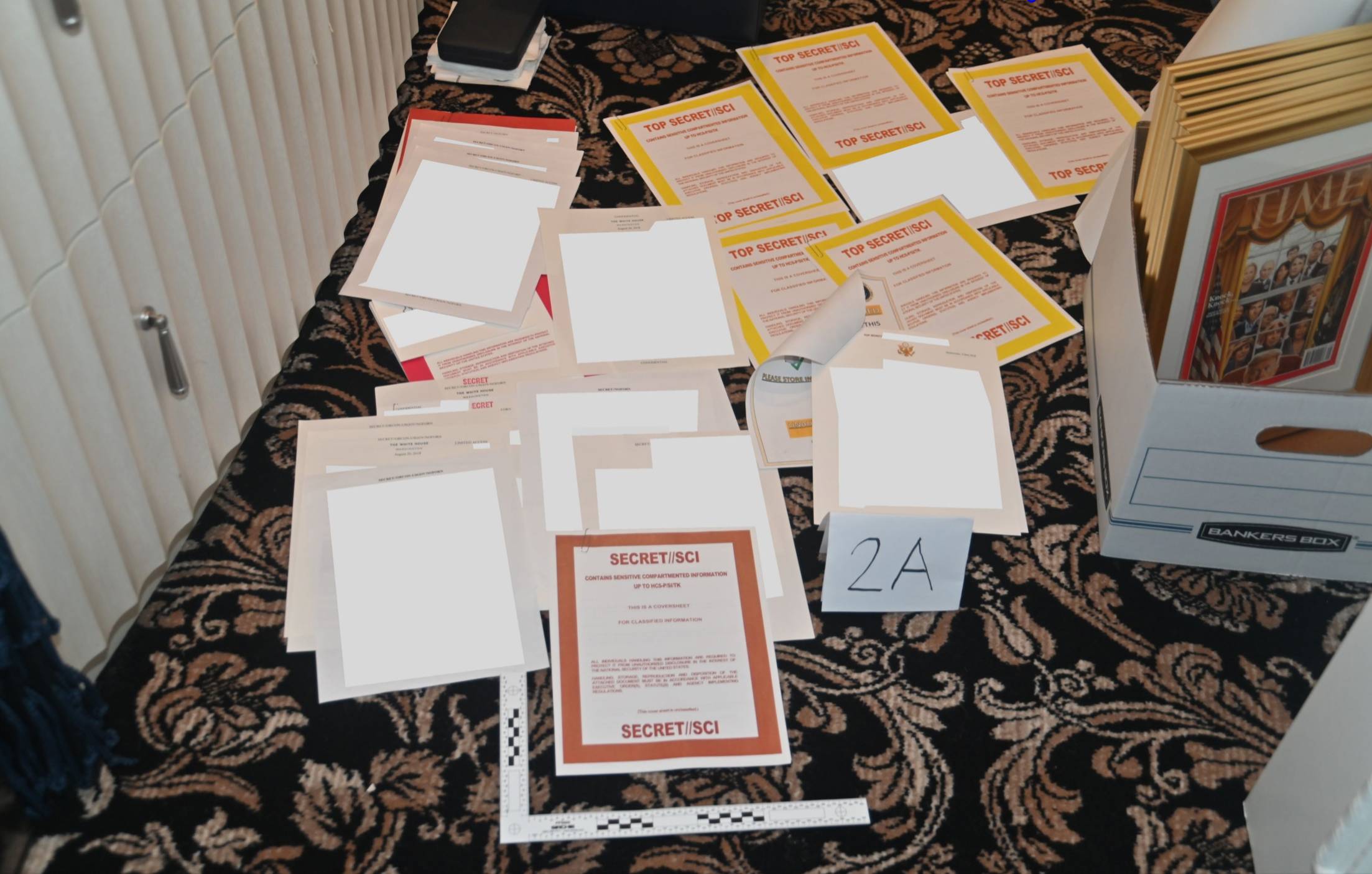 An image the U.S. Department of Justice included in an Tuesday court filing shows documents marked as secret that were recovered from Donald Trump’s Mar-a-Lago club and home in Florida. | Department of Justice / via The New York Times
