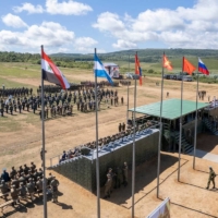 Participants attend a ceremony opening Vostok 2022 military exercises at a firing ground in the far eastern Primorsky region, Russia, on Wednesday. | RUSSIAN DEFENSE MINISTRY / VIA REUTERS