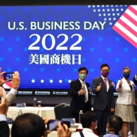 Arizona Gov. Doug Ducey (right) in a group photo ahead of the opening of the U.S. Business Day event in Taipei on Wednesday. | REUTERS