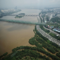 The flooded Han River seen from an observation platform in Seoul, on Aug 11  | REUTERS