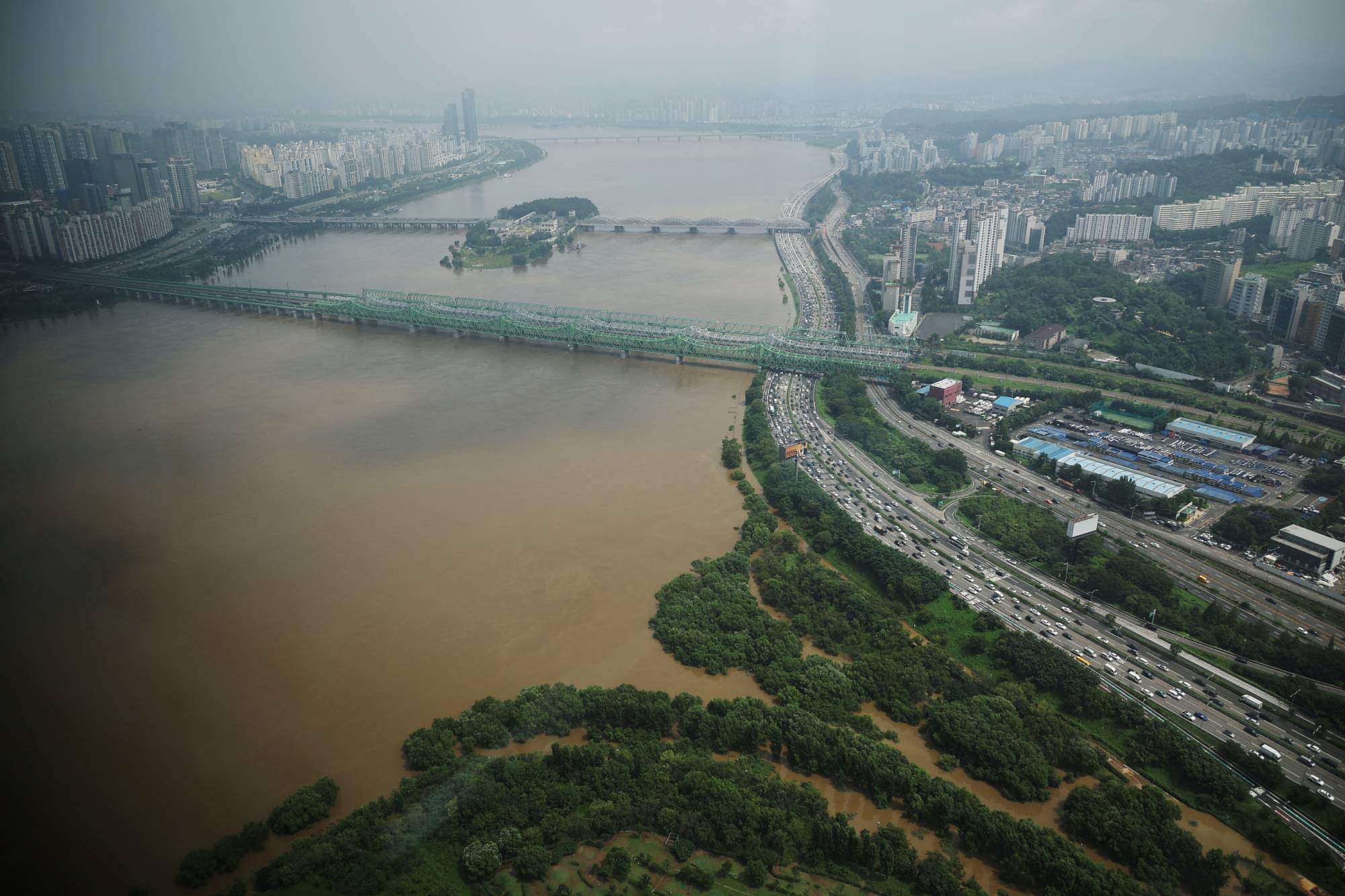 The flooded Han River seen from an observation platform in Seoul, on Aug 11 | REUTERS