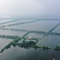 Submerged buildings and fields after heavy rain caused flooding in Panjin, China, on Aug. 4 | AFP-JIJI
