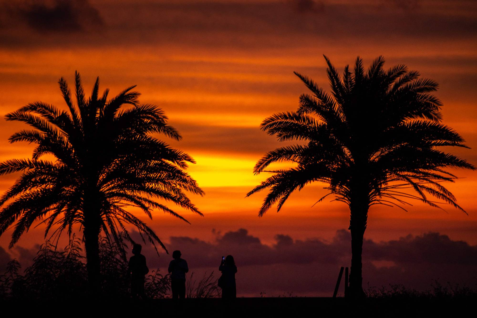 Naminoue Umisora Park during sunset in Naha on Aug. 21. With eased restrictions soon coming into force, the only tourists who won't be allowed to enter Japan will be those who want to stay in accommodations that travel agencies don’t offer in their “package tours.' | AFP-JIJI