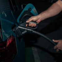 A motorist connects a charging plug to a Volkswagen AG ID.3 electric vehicle (EV) at a charging station in Bratislava, Slovakia, on Tuesday. | BLOOMBERG