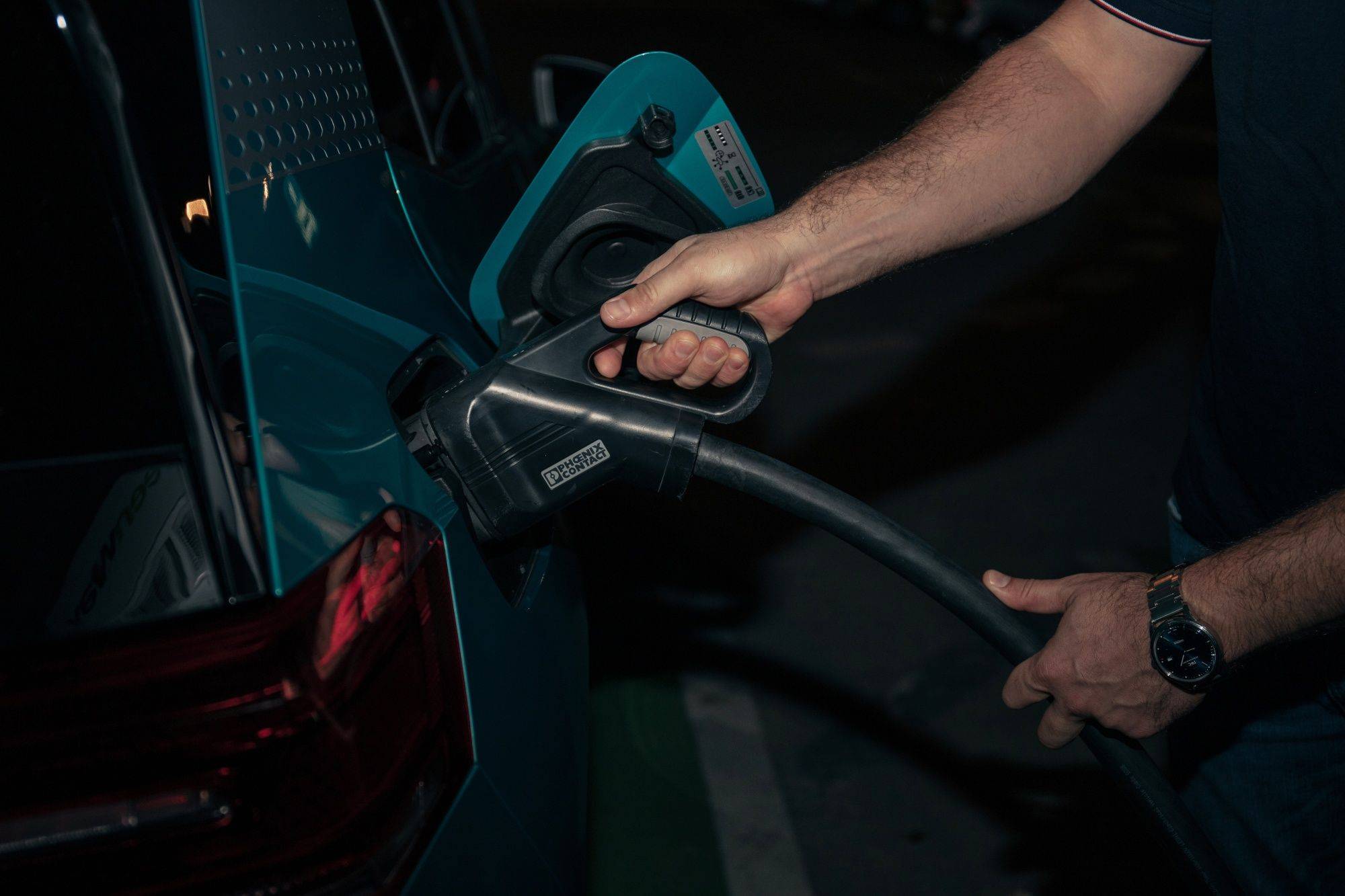 A motorist connects a charging plug to a Volkswagen AG ID.3 electric vehicle (EV) at a charging station in Bratislava, Slovakia, on Tuesday. | Bloomberg