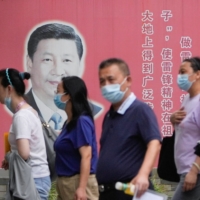 A portrait of Chinese President Xi Jinping in Shanghai on Wednesday | REUTERS