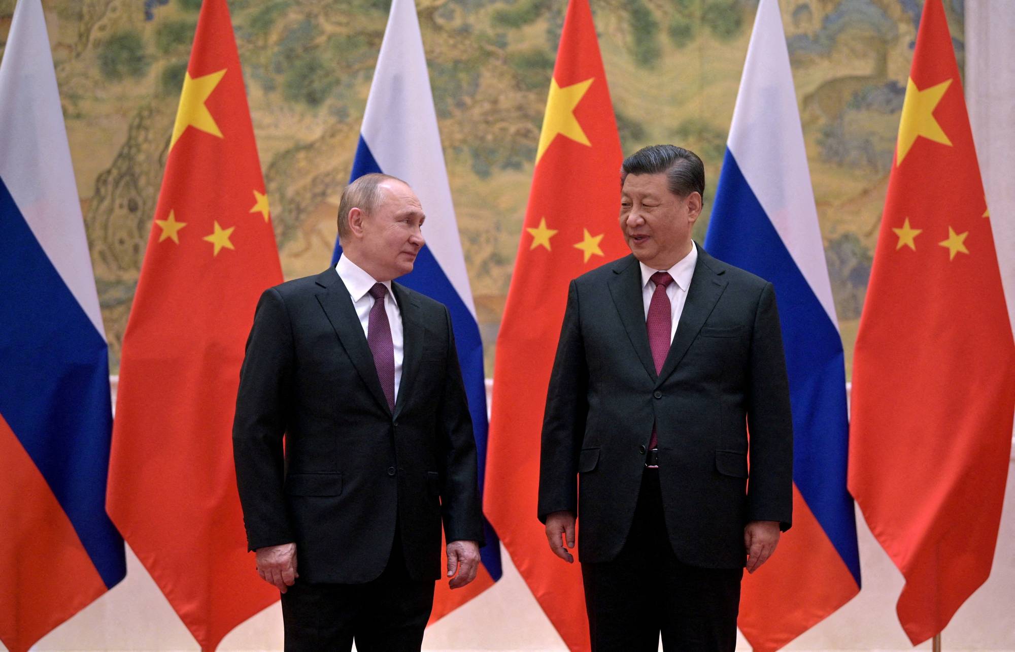 Russian President Vladimir Putin attends a meeting with Chinese President Xi Jinping in Beijing on Feb. 4. | Sputnik / Kremlin / via REUTERS 