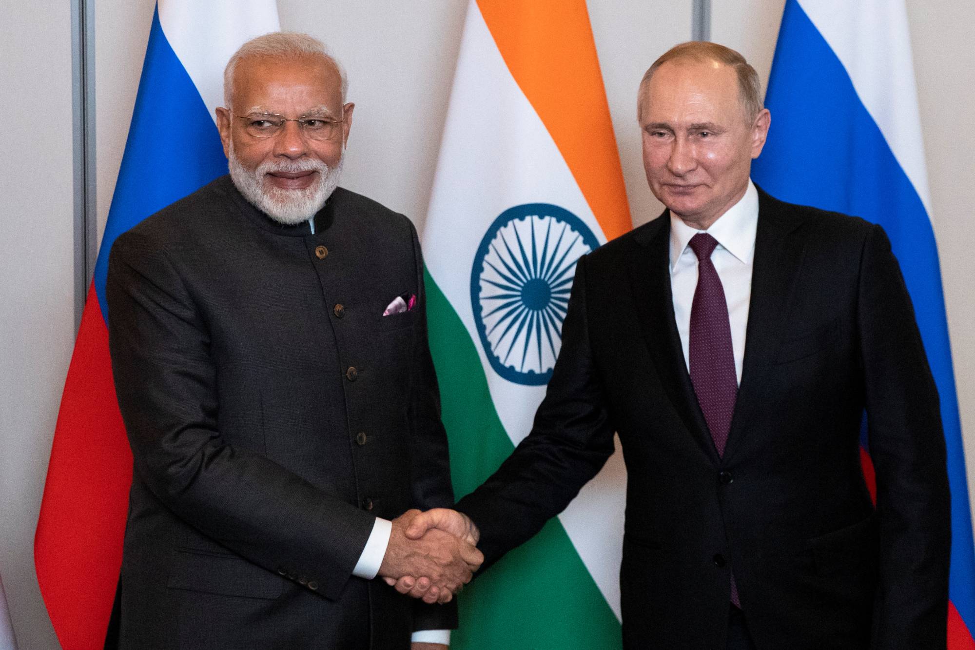 Indian Prime Minister Narendra Modi (left) and Russian President Vladimir Putin. The two leaders' nations are in a crucial position for China, both occupying positions in BRICS and the Shanghai Cooperation Organization. | Pool / via Reuters