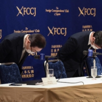 Tomihiro Tanaka (left), president of the Family Federation for World Peace and Unification, and another senior leader of the Unification Church, take part in a news conference at the Foreign Correspondents’ Club in Tokyo on Aug. 10. | AFP-JIJI