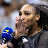 Williams gets emotional during a post-match interview on Friday at the U.S. Open. The American superstar lost a three-set battle in what was likely her final match. | AFP-JIJI