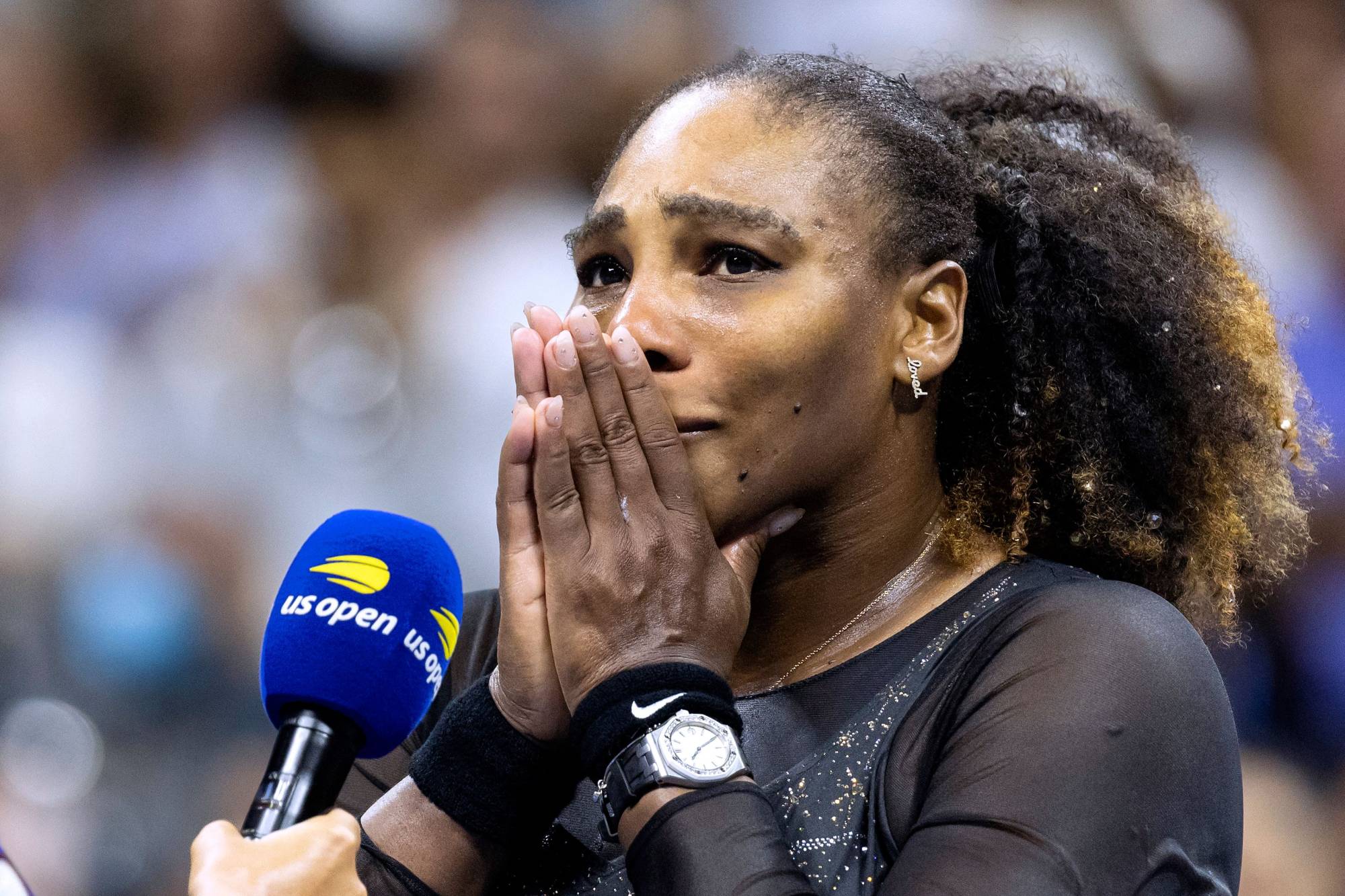 Williams gets emotional during a post-match interview on Friday at the U.S. Open. The American superstar lost a three-set battle in what was likely her final match. | AFP-JIJI