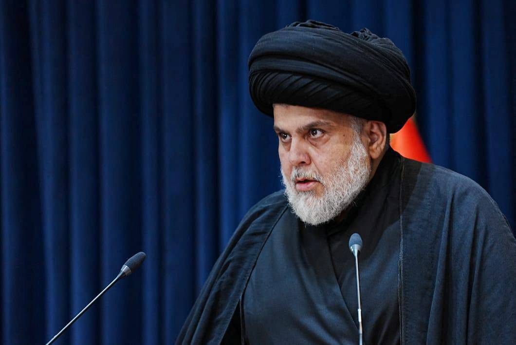 Iraqi Shiite cleric Moqtada al-Sadr speaks during a news conference in Najaf, Iraq, on Aug. 30.  | Sadr office / via REUTERS 