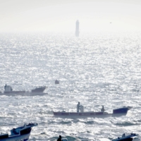 Kelp fishing boats on the waters off the Habomai group of islets in June 2019 | KYODO