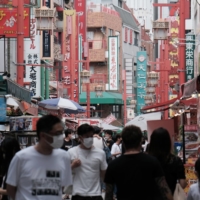 Japan’s households spending and real wages fell again in July amid a surge in COVID-19 cases and an increase in the cost of living. | BLOOMBERG