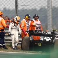 AlphaTauri driver Yuki Tsunoda leaves his car following a technical issue during the Dutch Grand Prix in Zandvoort, Netherlands, on Sunday. | AFP-JIJI