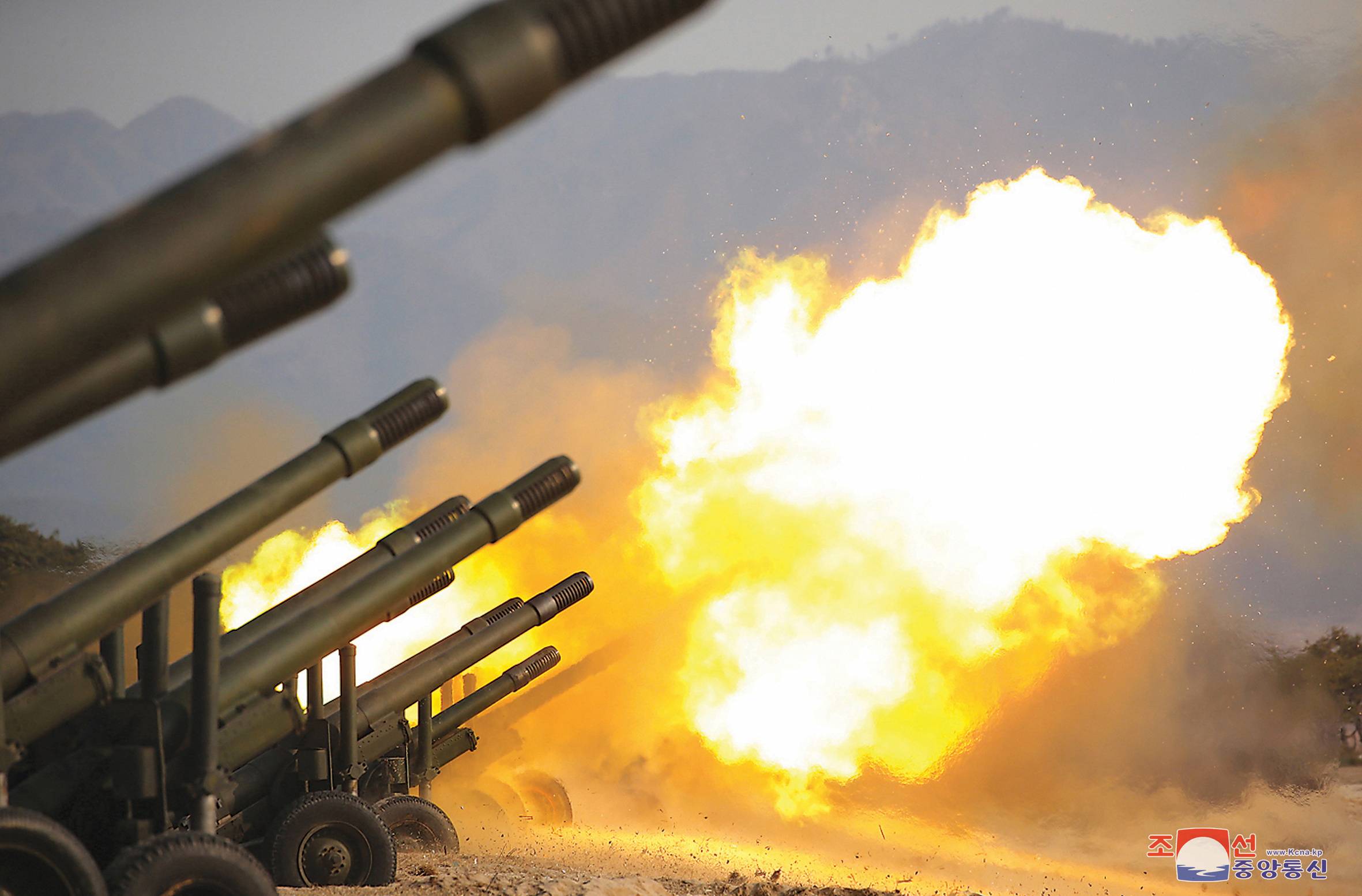 An artillery fire competition between units under the Korean People's Army Corps 7 and Corps 9 takes place at a training ground in North Korea in March 2020. | KCNA VIA REUTERS 