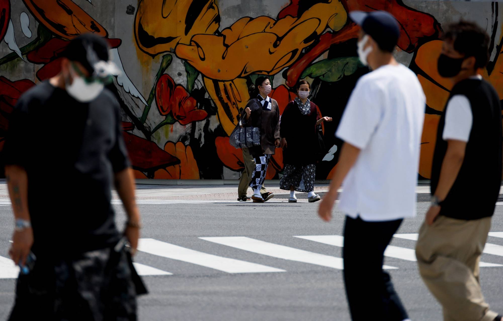 People in Tokyo on Aug. 8 | REUTERS