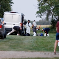 A police forensics team investigates a crime scene after multiple people were killed and injured in a stabbing spree in Weldon, Saskatchewan, Canada, on Sunday. | REUTERS