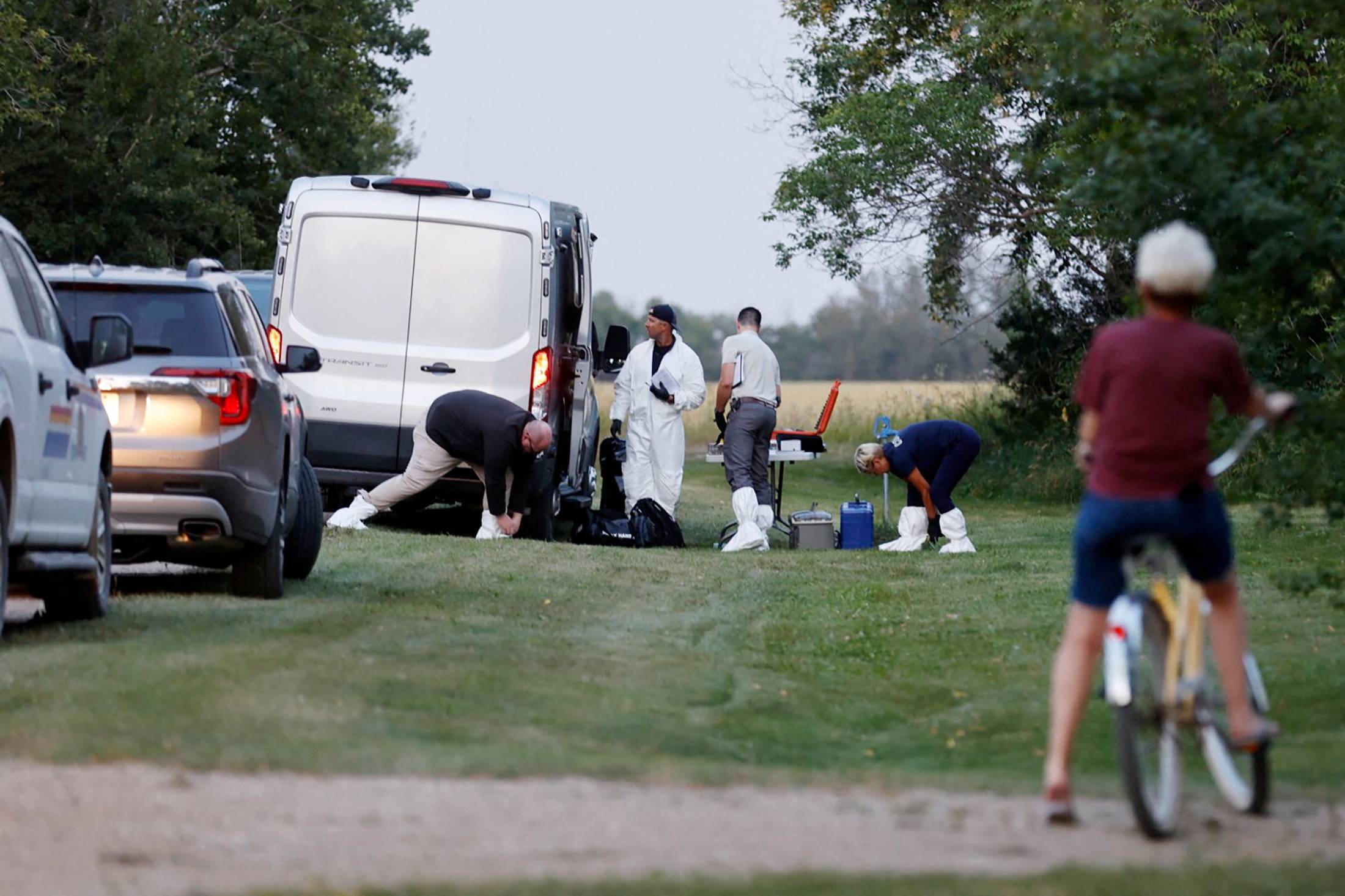 A police forensics team investigates a crime scene after multiple people were killed and injured in a stabbing spree in Weldon, Saskatchewan, Canada, on Sunday. | REUTERS