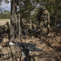 Ukrainian soldiers near the Kherson front on Monday | JIM HUYLEBROEK/THE NEW YORK TIMES