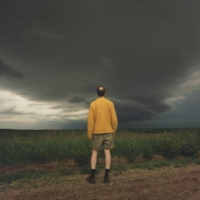 A researcher with the Targeted Observation by Radars and UAS of Supercells team watches a storm near Arnold, Nebraska, on June 9.  | ERINN SPRINGER/THE NEW YORK TIMES