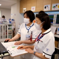 Nurses at a hospital in Takatsuki, Osaka Prefecture, in May 2021. | REUTERS