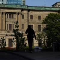 The Bank of Japan is likely to end its pandemic-relief funding scheme this month as scheduled, turning its attention towards broader risks such as rising input costs. | BLOOMBERG