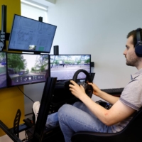 An operator controls a Fetch driverless car during trials from the office of Imperium Drive in Milton Keynes, England, on June 8. | REUTERS 