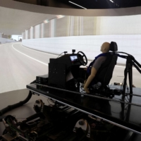 AB Dynamics staff run a demonstration of the advanced Vehicle Driving Simulator (aVDS) in Bradford on Avon, England, on June 20. | REUTERS 