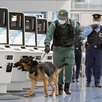 Police officers patrol Haneda Airport in Tokyo ahead of the state funeral for former Prime Minister Shinzo Abe. | KYODO