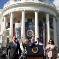 U.S. President Joe Biden and first lady Jill Biden are flanked by U.S. Vice President Kamala Harris and her husband Doug Emhoff following an event to celebrate the enactment of the \"Inflation Reduction Act of 2022,\" at the White House in Washington on Tuesday. | REUTERS