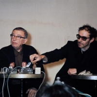 Philosopher and writer Jean-Paul Sartre (left) and Godard answer questions from the media in Paris in 1971. | AFP-JIJI
