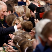 King Charles III meets with the public at Hillsborough Castle in Northern Ireland on Tuesday. | REUTERS