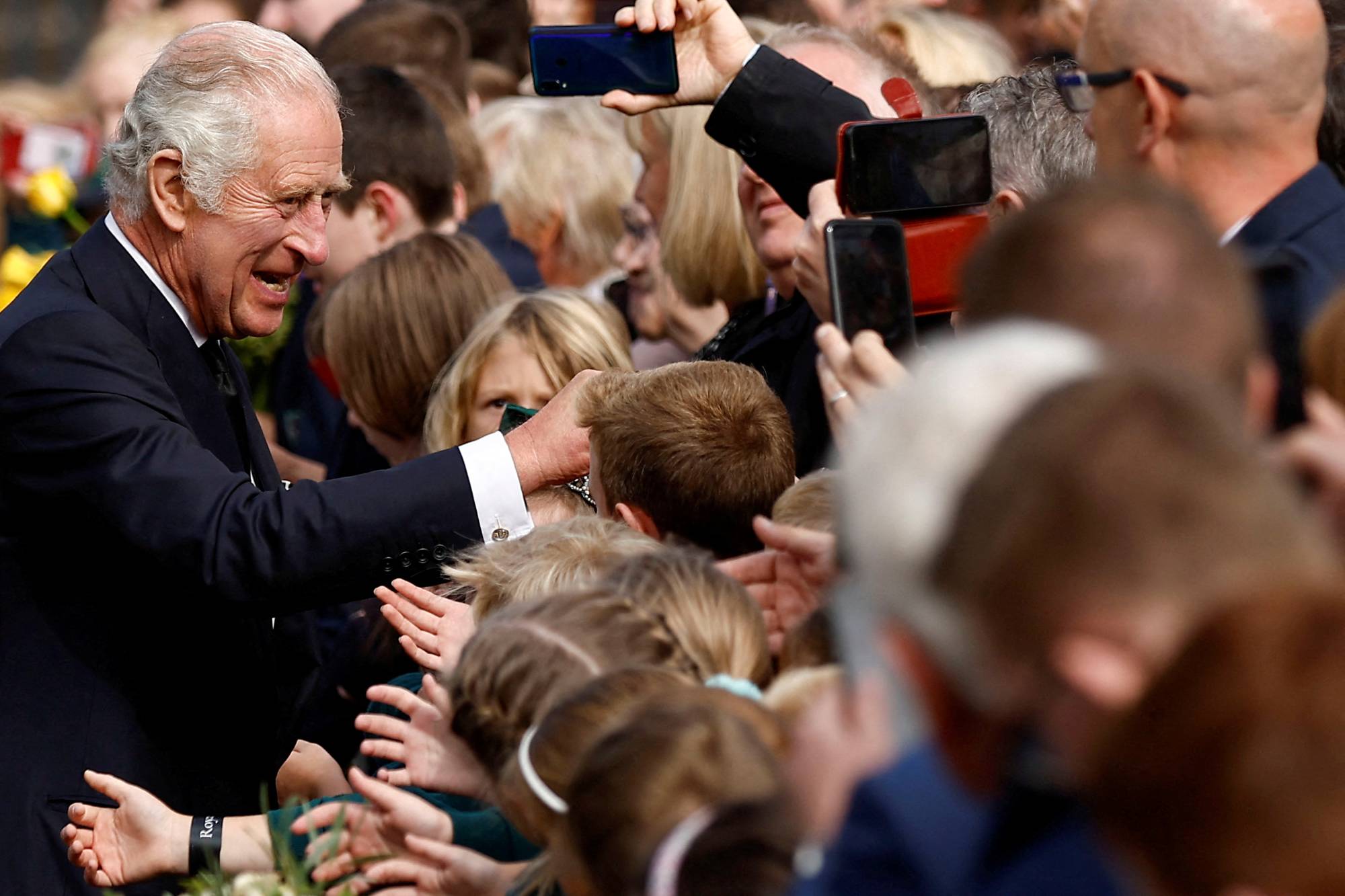 King Charles III meets with the public at Hillsborough Castle in Northern Ireland on Tuesday. | Reuters