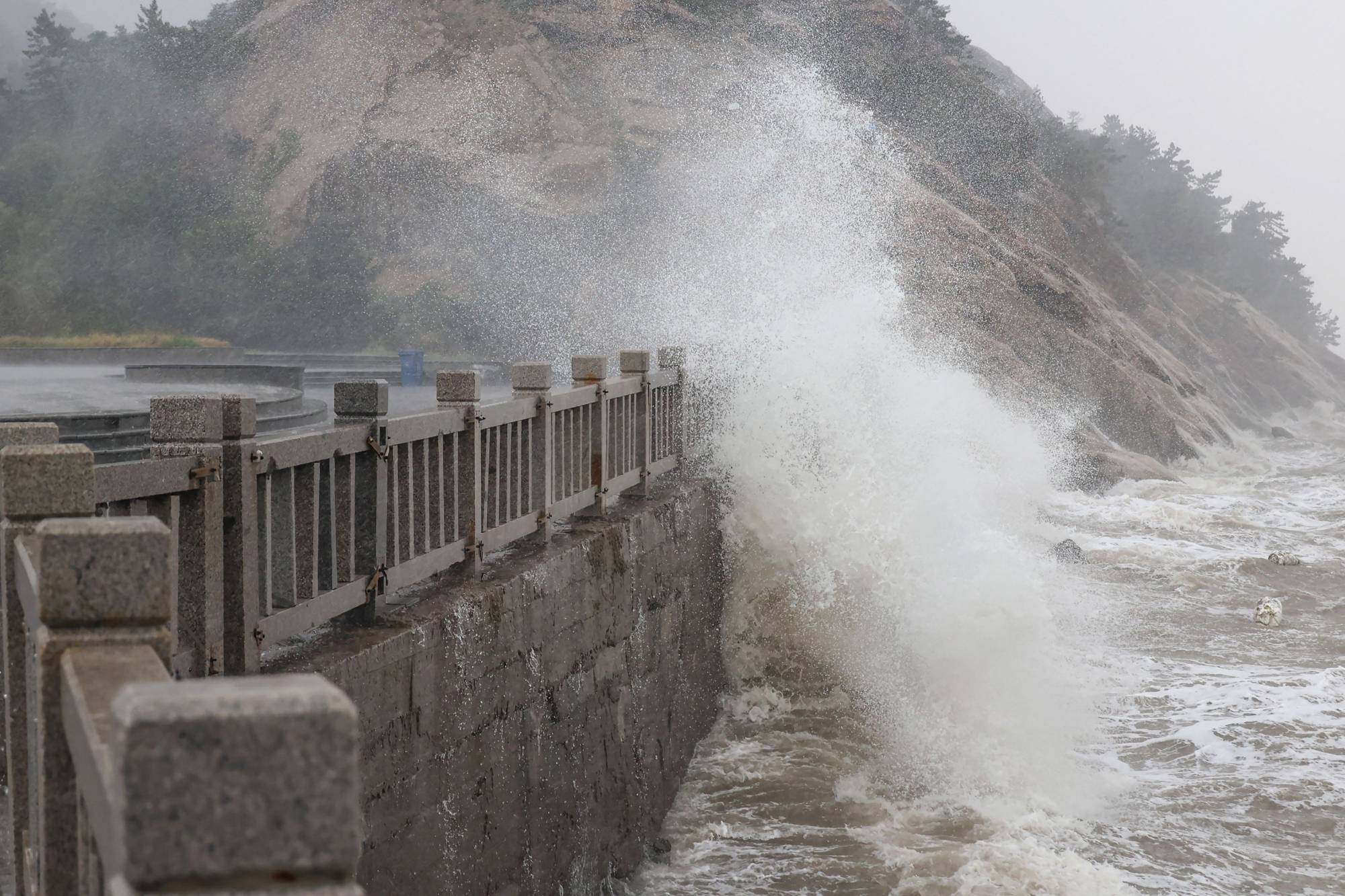 Waves generated by Typhoon Muifa break along the coast in Lianyungang in China's eastern Jiangsu province on Wednesday. | AFP-JIJI