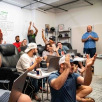 Employees celebrate during Wordle Wednesday at the Jomboy Media offices in New York, on Aug. 10. Jimmy O\'Brien\'s videos breaking down major events turned Jomboy Media into a big business, but O\'Brien still sees himself as a fan.  | DESIREE RIOS THE NEW YORK TIMES