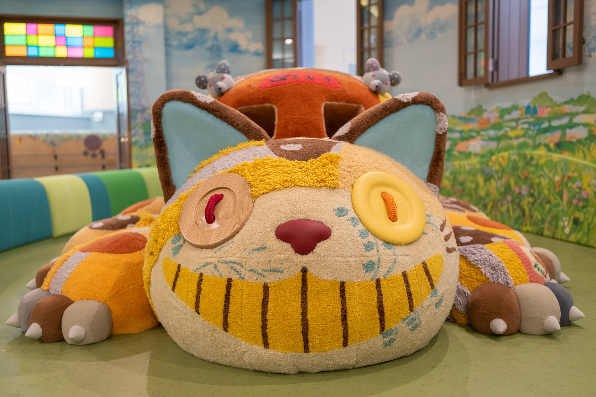 The Cat Bus character from 'My Neighbor Totoro' inside a playroom in Ghibli's Grand Warehouse at Ghibli Park | © STUDIO GHIBLI / VIA KYODO