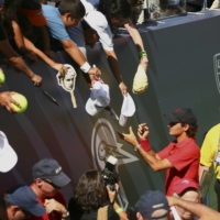 Federer signs autographs during Aurthur Ashe Kids’ Day, before the start of the U.S. Open in New York, on Aug. 23, 2008. Tennis has treated me more generously than I ever would have dreamed and now I must recognize when it is time to end my competitive career, Federer said.  | MICHAEL NAGLE / THE NEW YORK TIMES