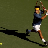 Federer returns a volley from Lleyton Hewitt during a match at the 2005 U.S. Open in New York, on Sept. 10, 2005. Tennis had lost its cachet in the early 2000s before Federer made the classic sport modern and the modern sport classier.  | ROBERT CAPLIN / THE NEW YORK TIMES