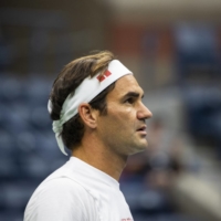 Roger Federer of Switzerland warms up before a match at the U.S. Open in New York, on Aug. 28, 2019. Federer, the elegant Swiss star who dominated men\'s tennis for two decades, announced his intent to retire on Thursday.  | CALLA KESSLER / THE NEW YORK TIMES
